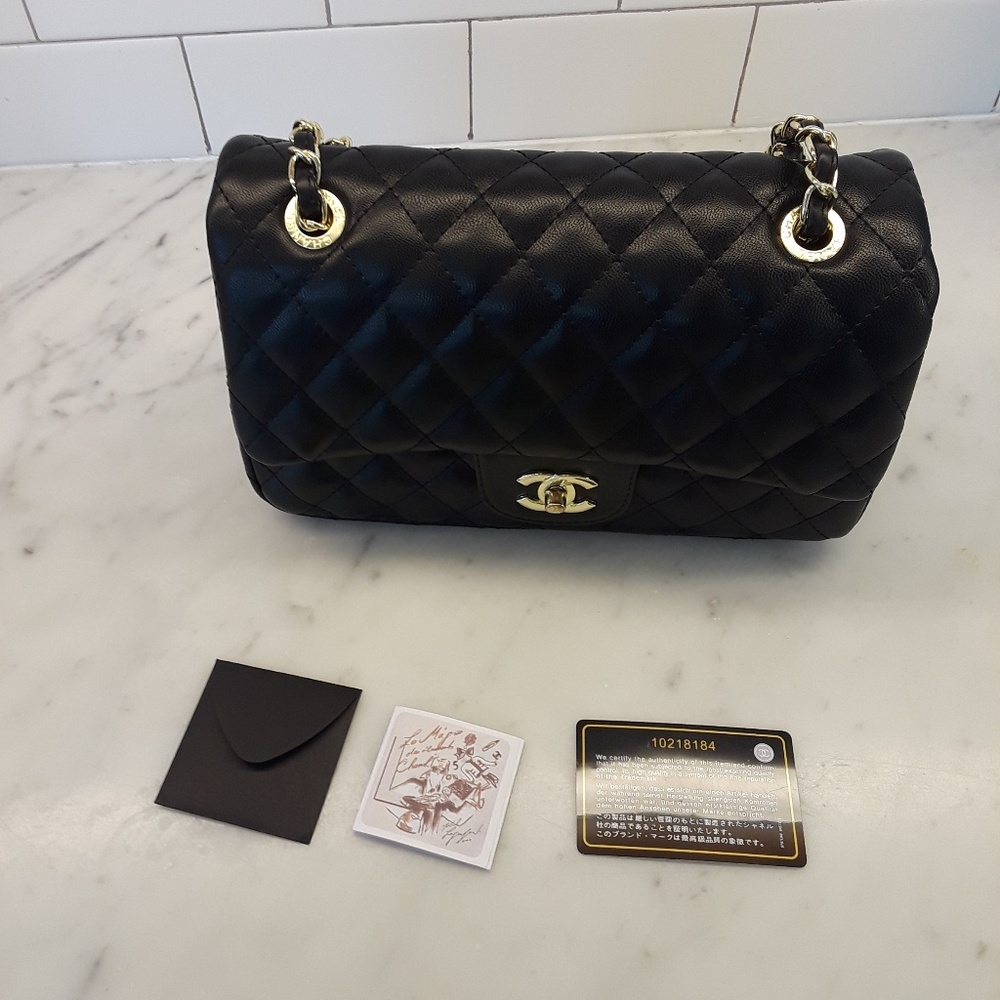 Authentic chanel black/gold chain shoulder bag